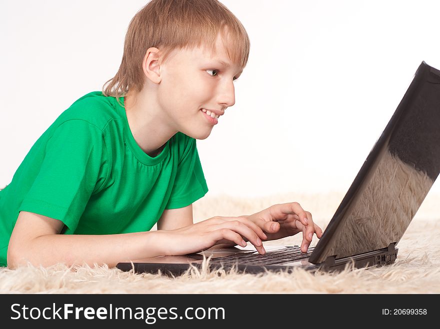 Portrait of a young boy with laptop