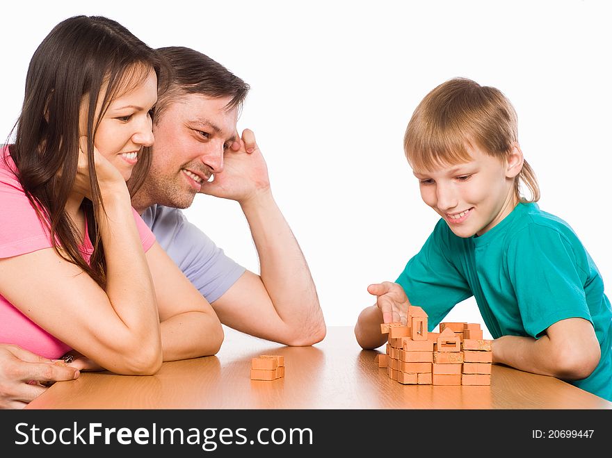 Cute Family Playing At Table