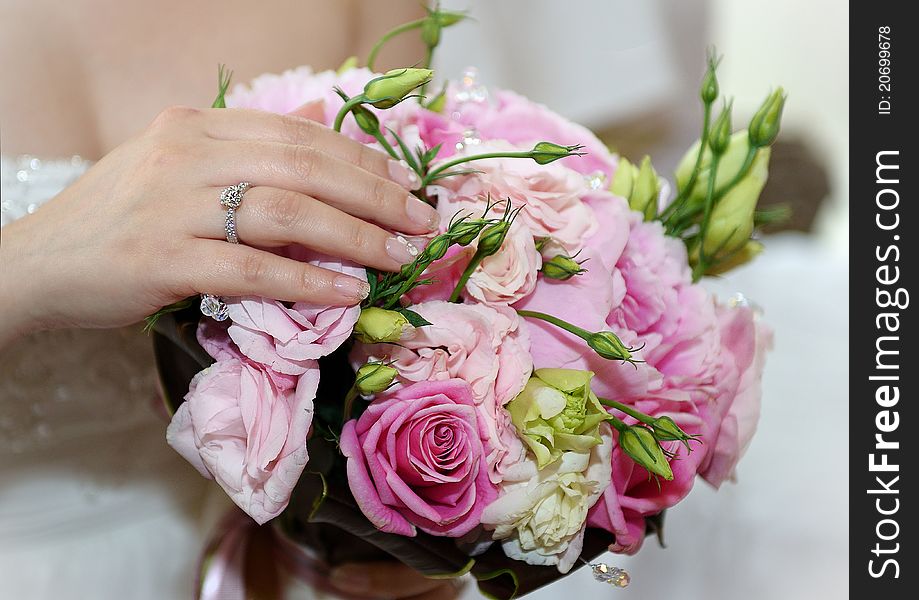 A relax bride with her roses. A relax bride with her roses.