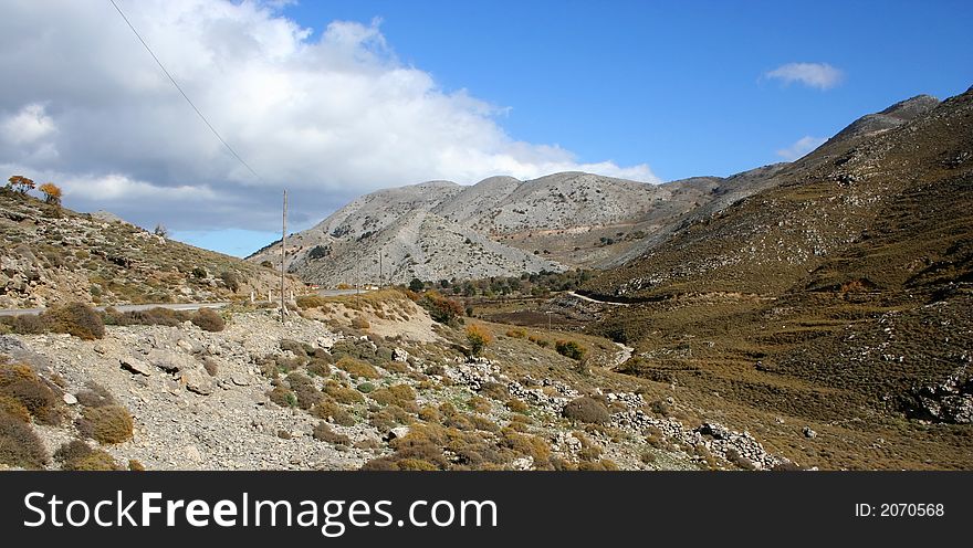 Rocky mountains on Crete (Greece). Road and telegraph line. Rocky mountains on Crete (Greece). Road and telegraph line.