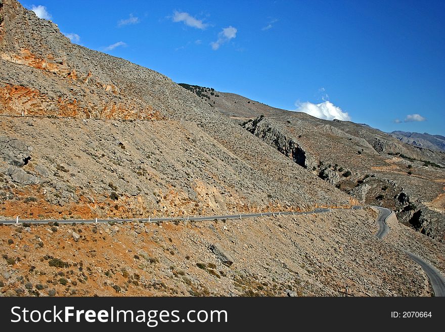 Narrow risky mountain road on Crete (Greece). Narrow risky mountain road on Crete (Greece).