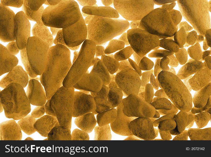 Golden background of a painted gravel. Golden background of a painted gravel