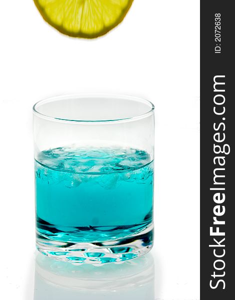 Photo of blue drink with a slice of lemon.