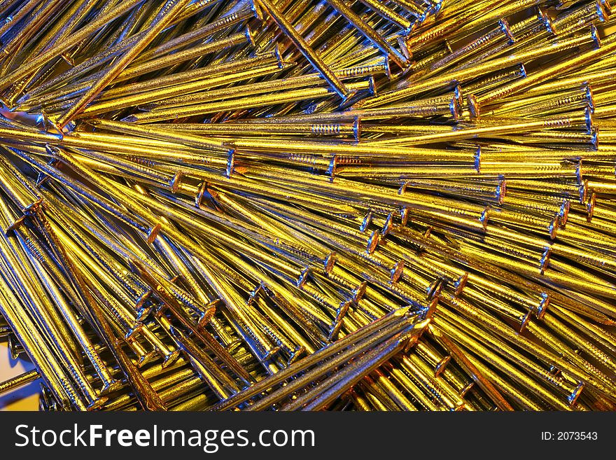 Arrangement of nails, in the light of two flash-units, one with a amber filter, the other with a blue one. Arrangement of nails, in the light of two flash-units, one with a amber filter, the other with a blue one