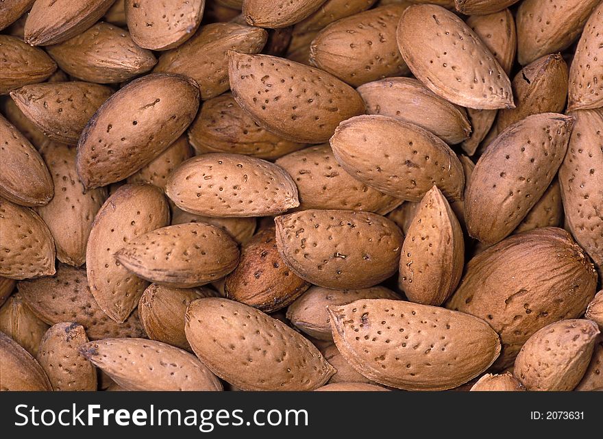 Set of the almond nuts laying on a table. Set of the almond nuts laying on a table