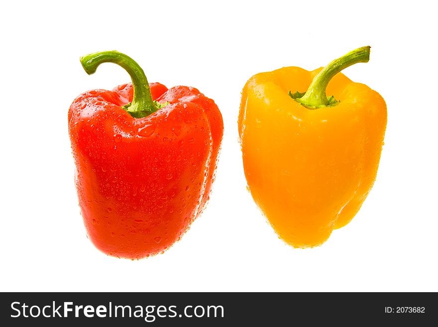 Red and Yellow Peppers the Covered Drops of Water. Isolated On White. Close-up. Red and Yellow Peppers the Covered Drops of Water. Isolated On White. Close-up