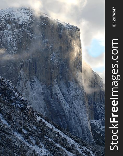 El Capitan illuminated by early morning stormy and misty skies. El Capitan illuminated by early morning stormy and misty skies