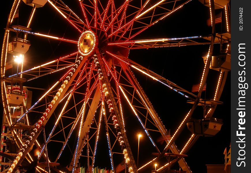 Small blur nightime ride of the ferris wheel. Small blur nightime ride of the ferris wheel