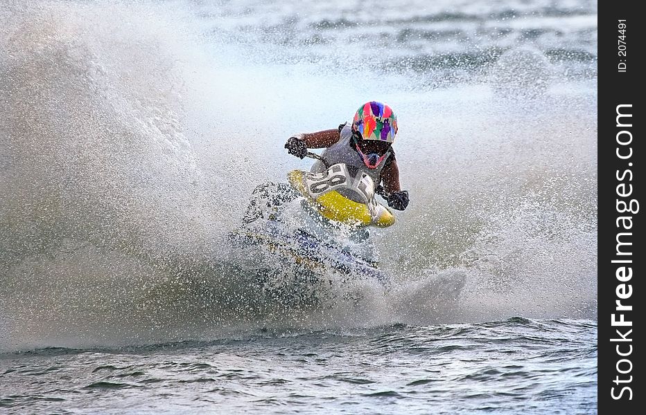 Jetbike rushes on waves with big speed so sparks fly