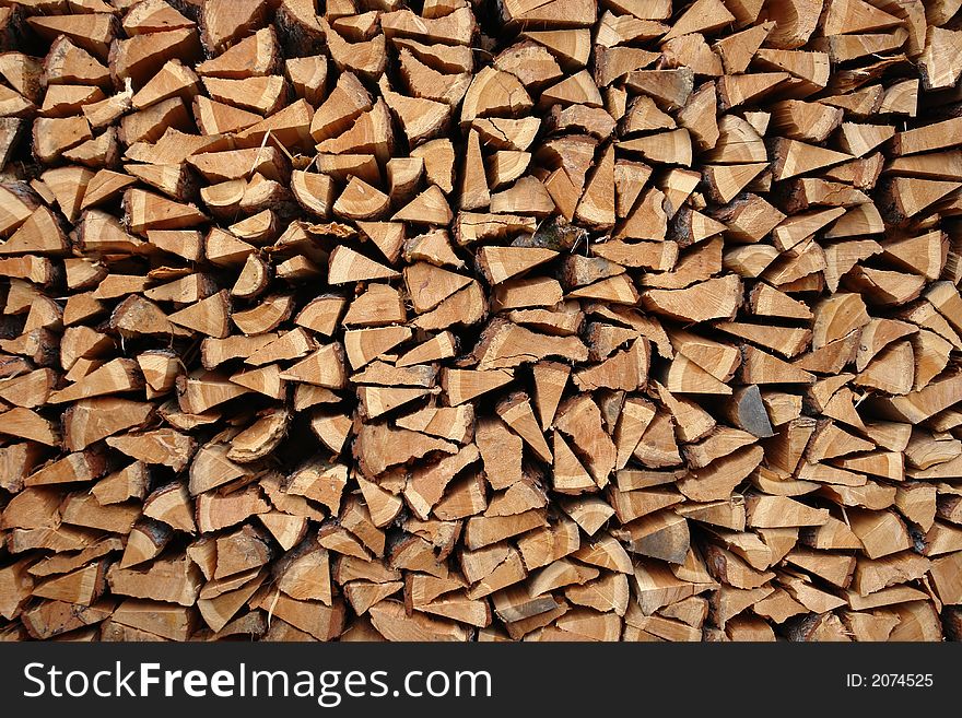 A pile of wooden logs laid together