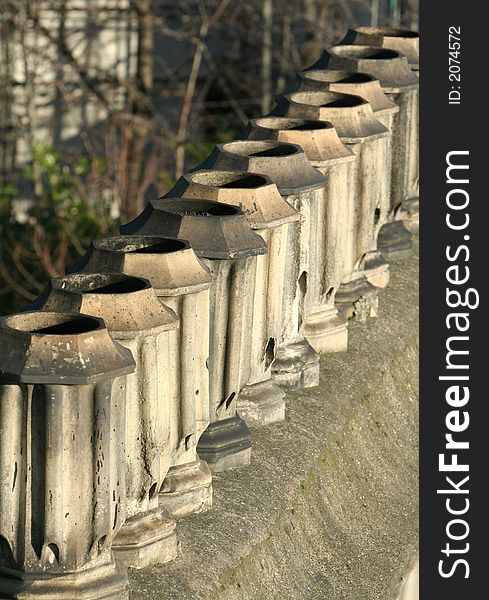 Arow of Victorian Chimney pots lined up in a row