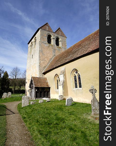 Twelfth Century English Village Church basking in early Spring Sunshine. Twelfth Century English Village Church basking in early Spring Sunshine