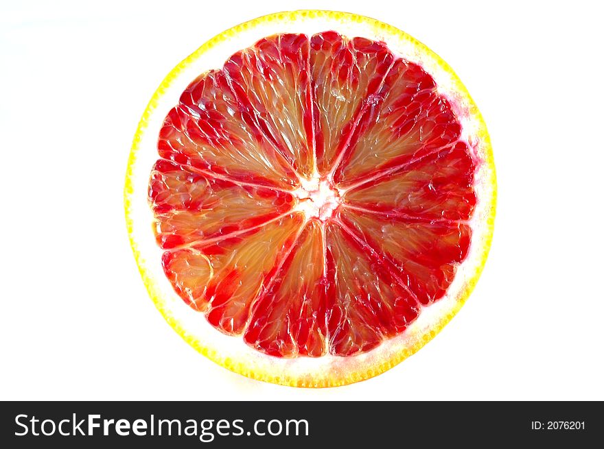 An isolated slice of an orange. An isolated slice of an orange