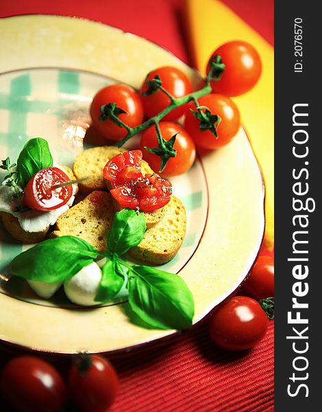 plate with bruschette ,tomatoes and vegetales, food