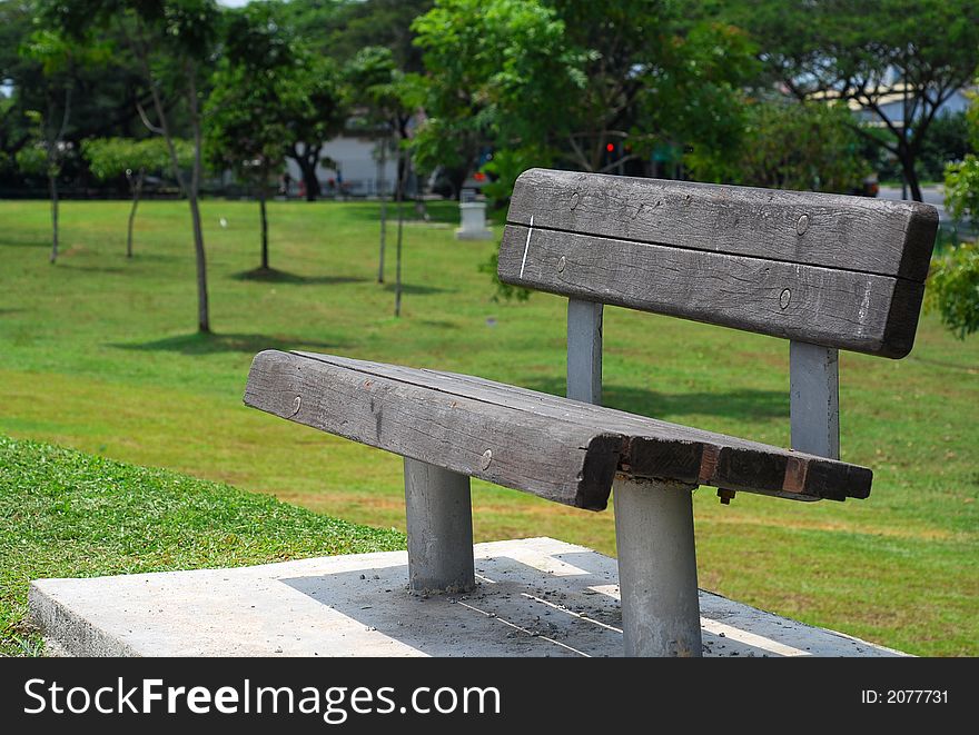 A wooden bench in the park