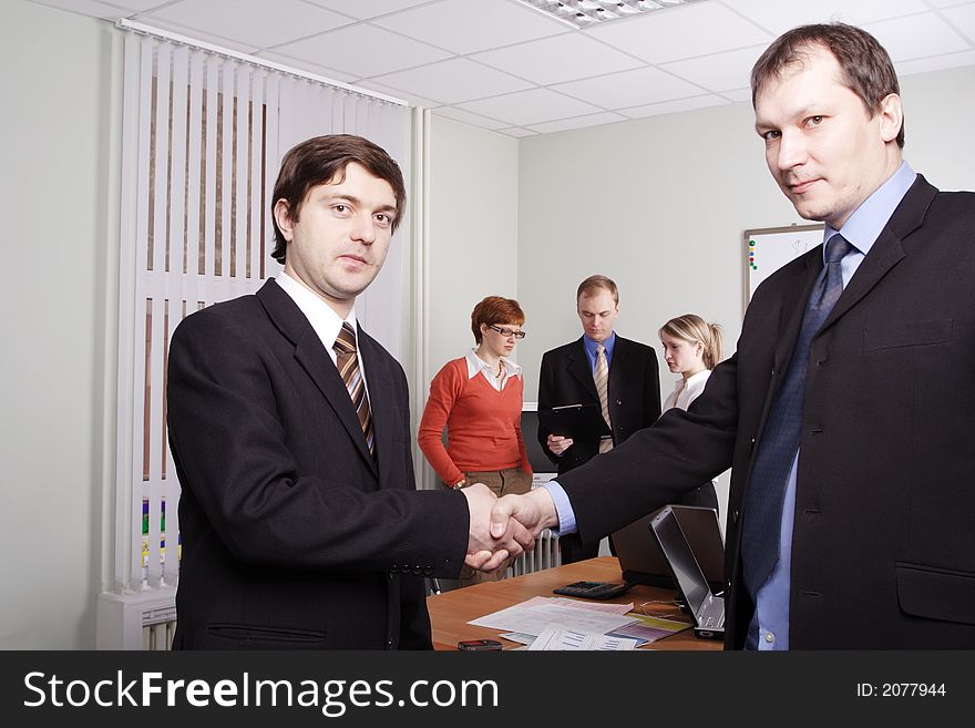 Group of business people working together in the office. Group of business people working together in the office.