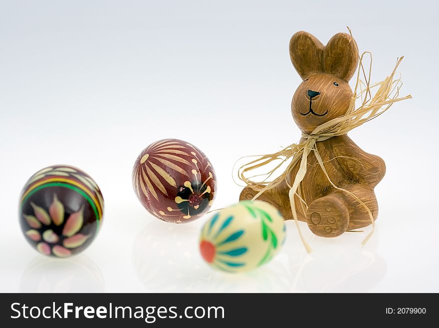 Easter bunny and easter eggs on white background. Low reflection. Easter bunny and easter eggs on white background. Low reflection.