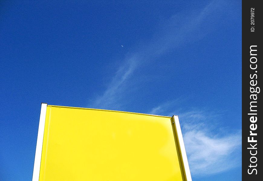Yellow blank billboard and blue sky