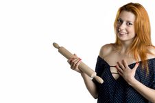Young Woman With A Wooden Rolling Pin Royalty Free Stock Image