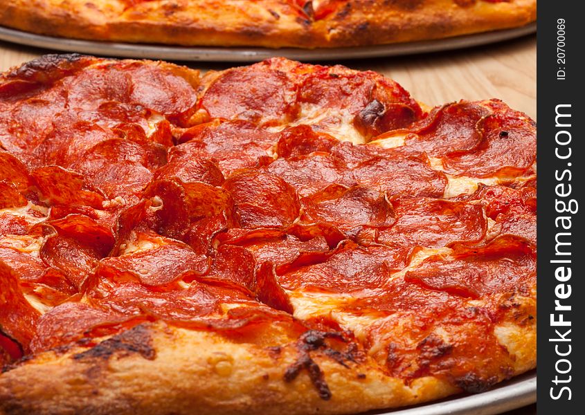 A very tempting image of a delicious pepperoni pizza. This image is a closeup to add uniqueness to the photograph.