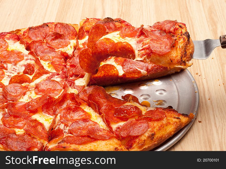 A very tempting image of a delicious pepperoni pizza. This image is a closeup to add uniqueness to the photograph.