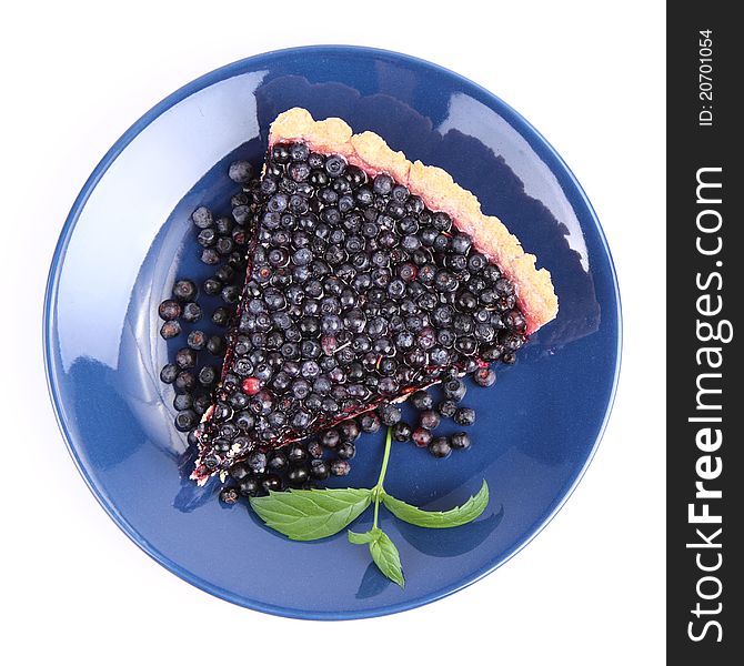 Blueberry Tart: a portion on a plate decorated with mint