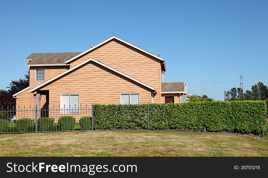 A large house and long fence, in a Portland suburb Oregon. A large house and long fence, in a Portland suburb Oregon.