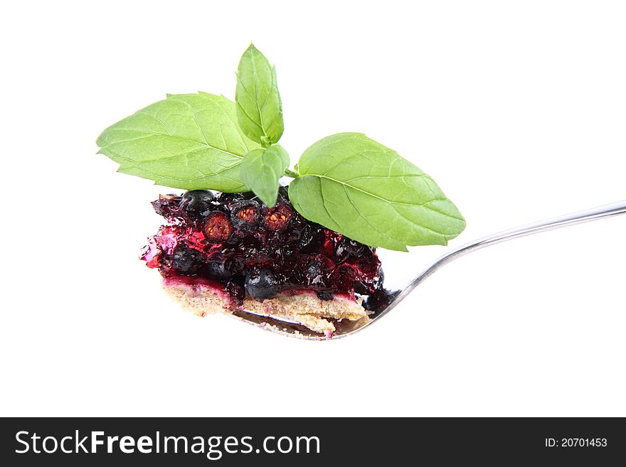 Blueberry Tart: a bite on a fork decorated with mint