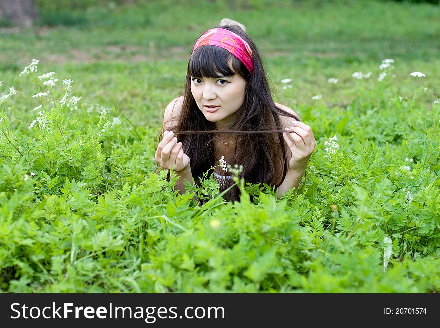 Erotic woman lying in grass wallpapers