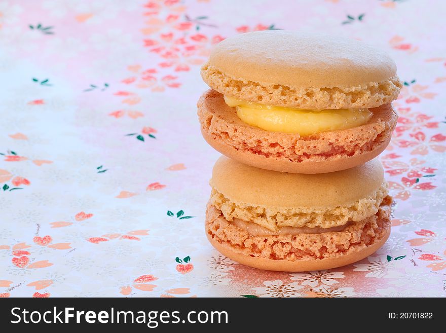 Macarons on the tablecloth with Japanese ornament. Macarons on the tablecloth with Japanese ornament.