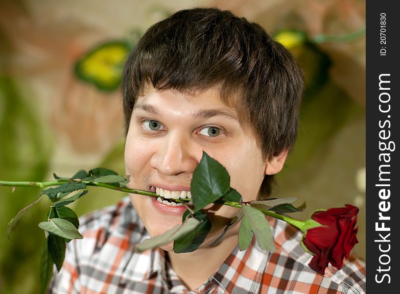 Young handsome man with rose. Young handsome man with rose