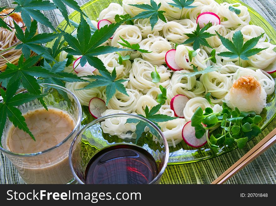 Japanese noodles served with radish and sauce. Japanese noodles served with radish and sauce.