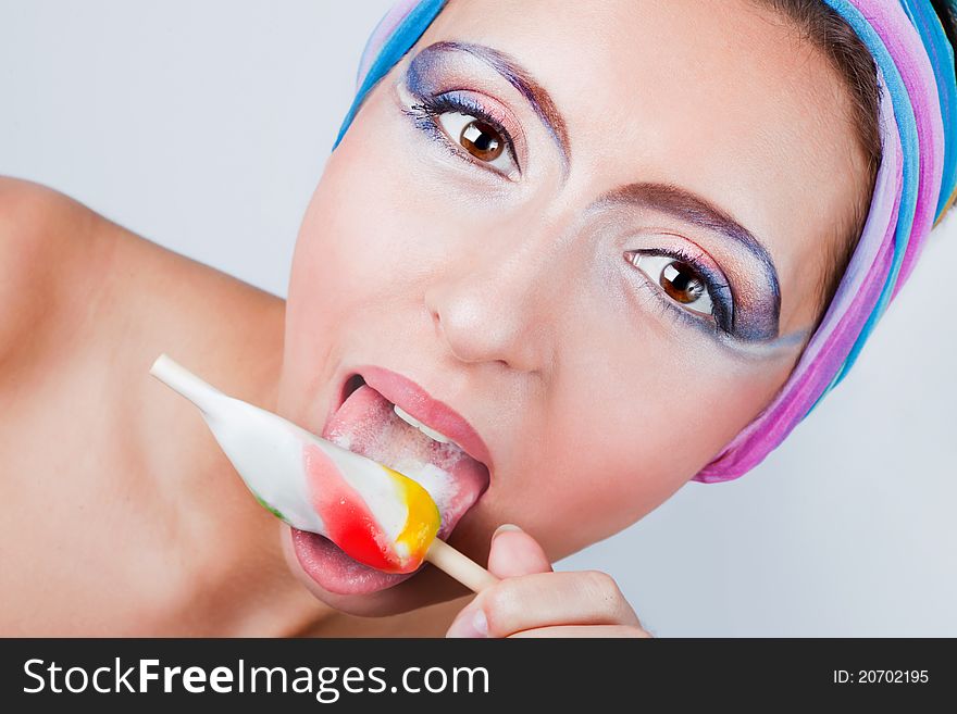 Portrait of young happy woman eating ice cream