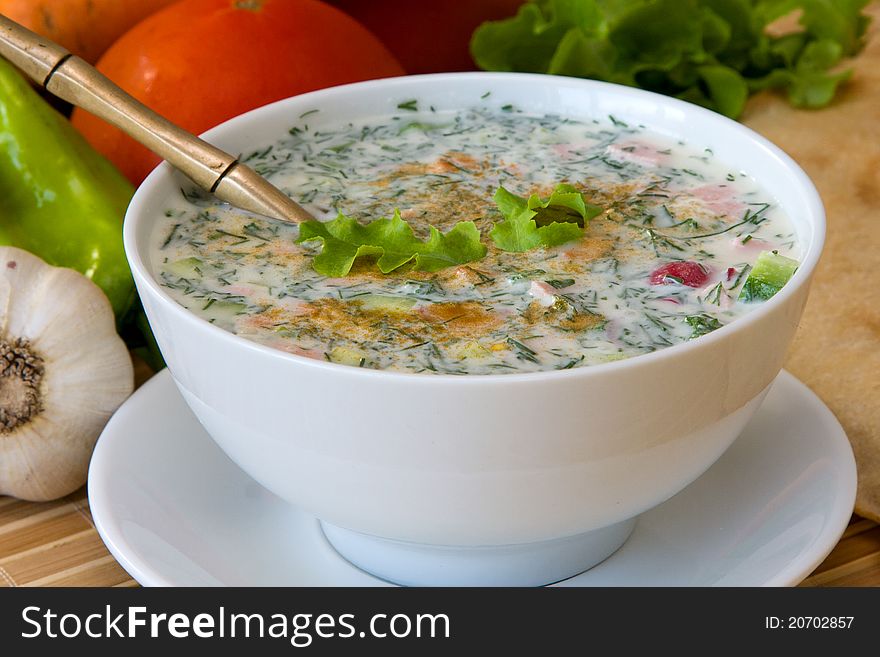 Cold soup with choped vegetables and me - okroshka