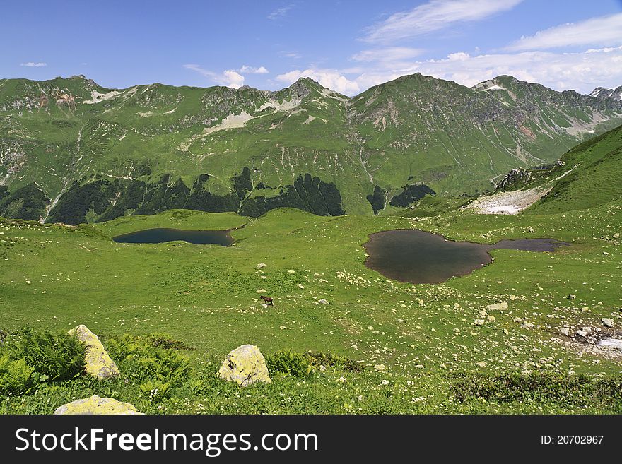 Two mountain lakes in summer season