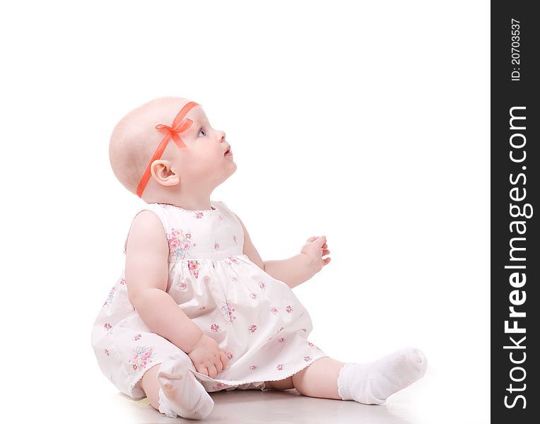 Sweet baby girl looking at something. Isolated over white background. Sweet baby girl looking at something. Isolated over white background.