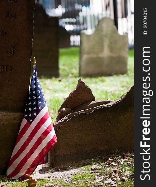 Graveyard with American flag in St Paul's churchyard near ground zero area New York City
