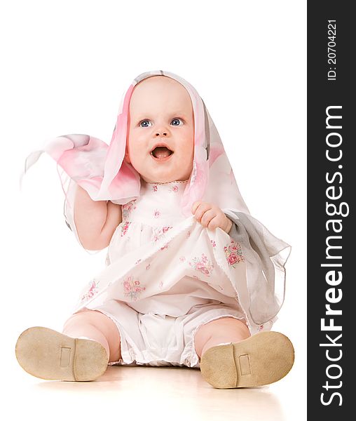 Baby girl playing with scarf. Over white background