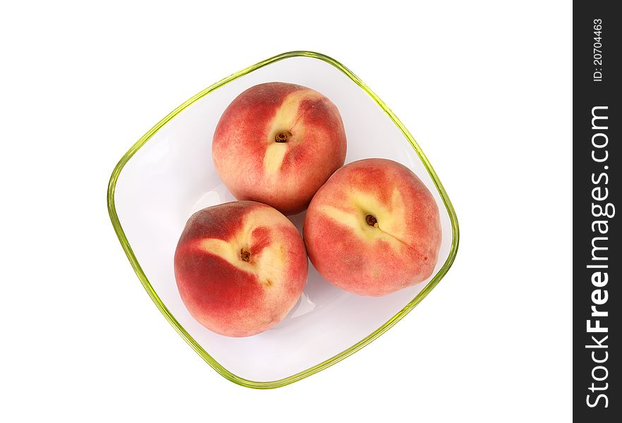 Still life with natural ripe peaches on a white background