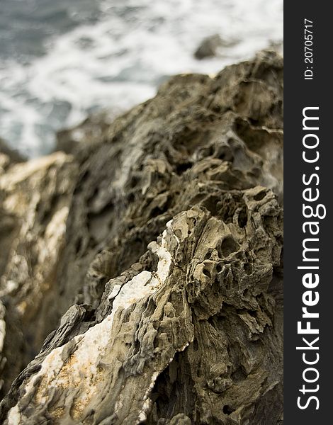 Close up view of the coastal rocks along the Cinque Terre coast in Italy.