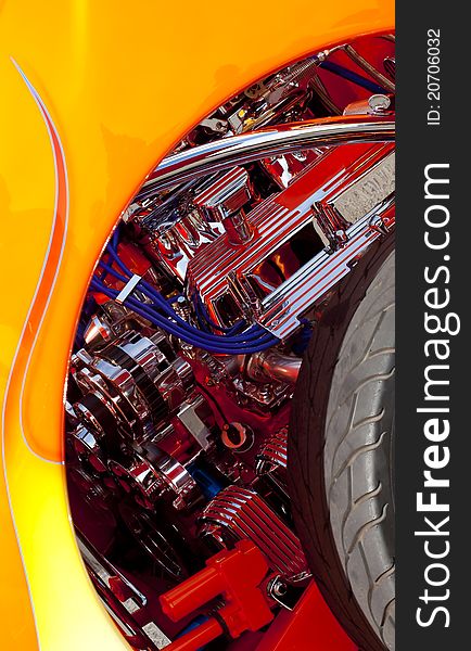 Classic Car Engine in chrome and red with flames and tire. Classic Car Engine in chrome and red with flames and tire