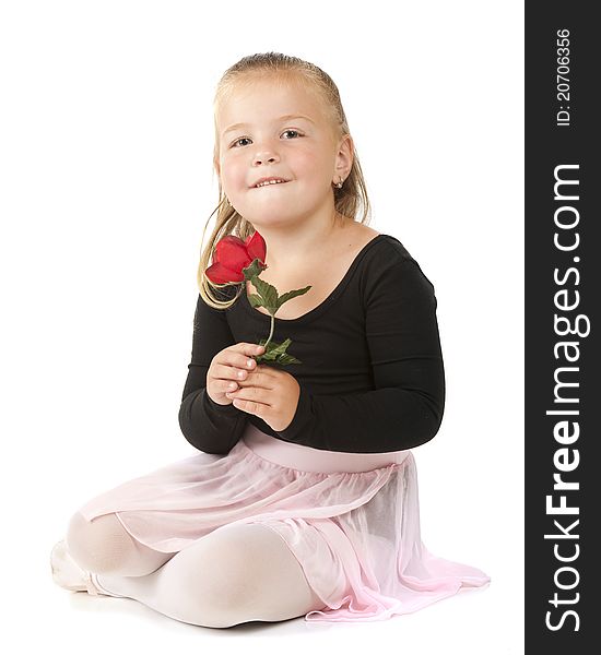 A beautiful preschool ballerina laying on her belly. Isolated on white. A beautiful preschool ballerina laying on her belly. Isolated on white.