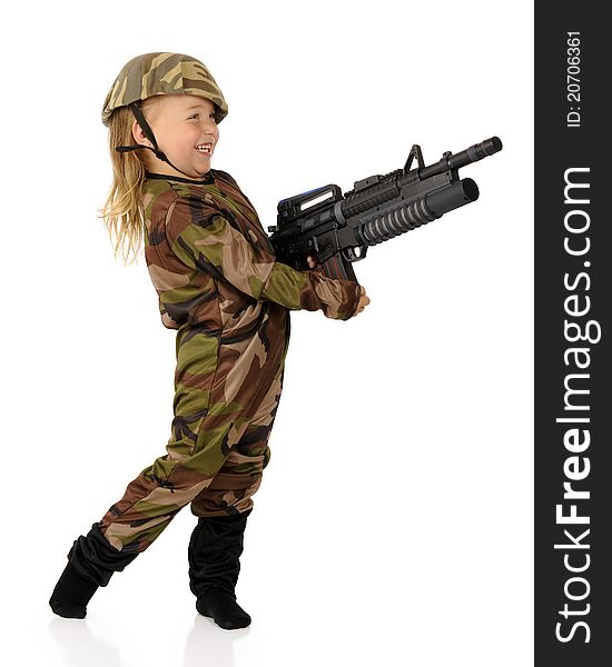 An adorable preschool soldier delightedly shooting her toy machine gun. Isolated. An adorable preschool soldier delightedly shooting her toy machine gun. Isolated.