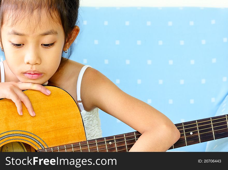 Young Girl And Guitar