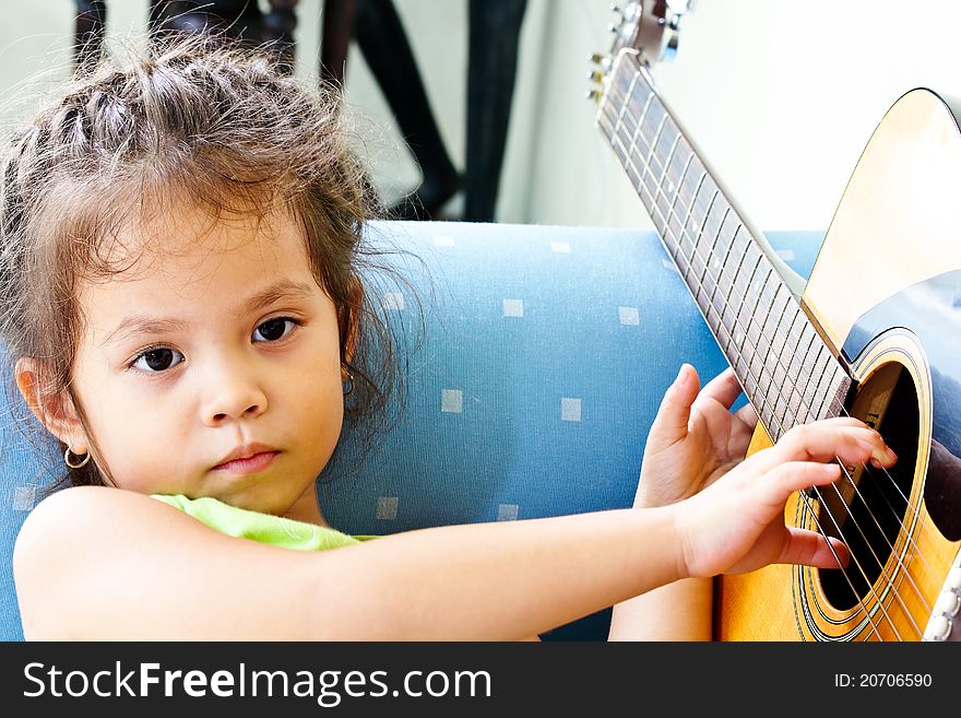 Children are thought to play a guitar or something