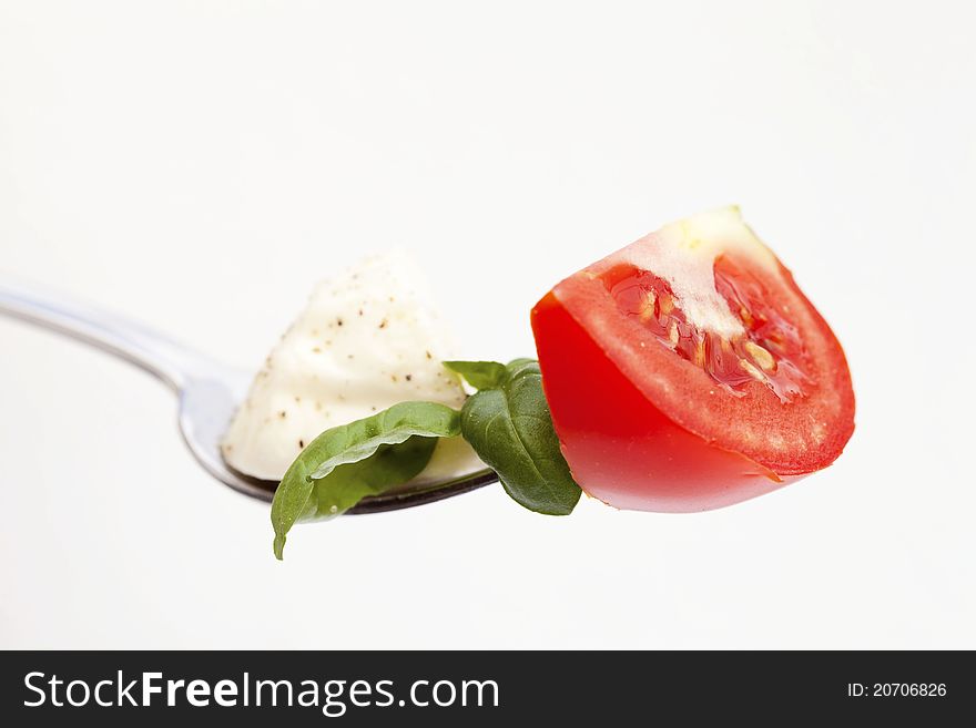 Tomato on fock isolated on white