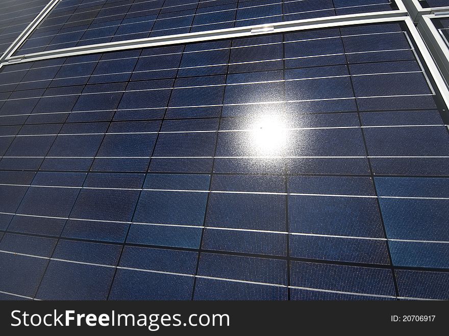 Close up of photovoltaic panels with sun reflected. Close up of photovoltaic panels with sun reflected