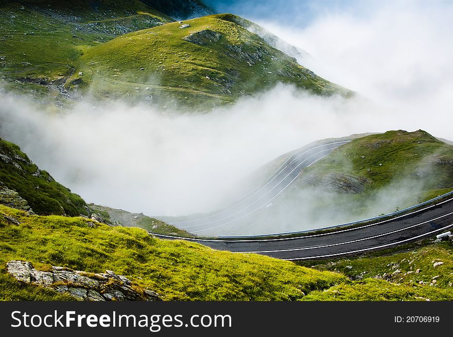 A mountain road crossing the clouds. A mountain road crossing the clouds