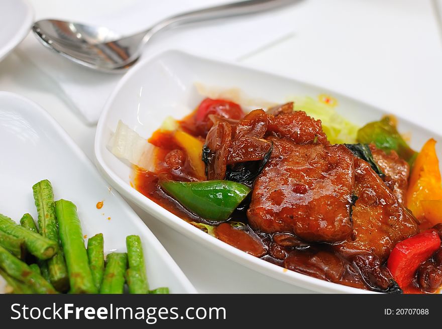 Deep fried vegetarian meat dish with colorful ingredients.