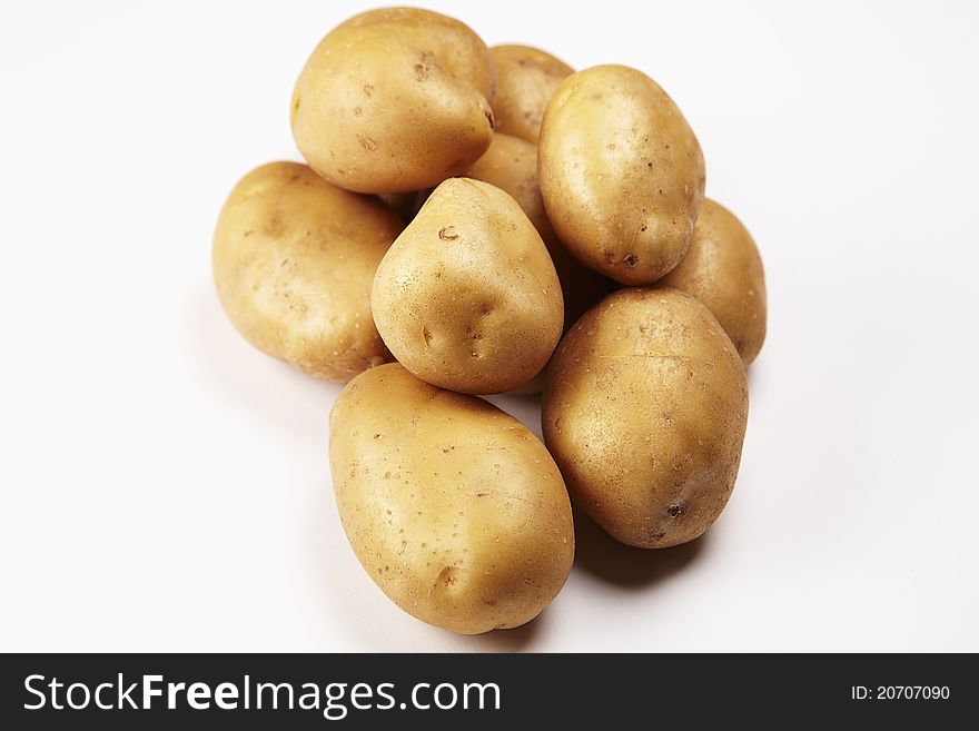 Some potatoes on white background